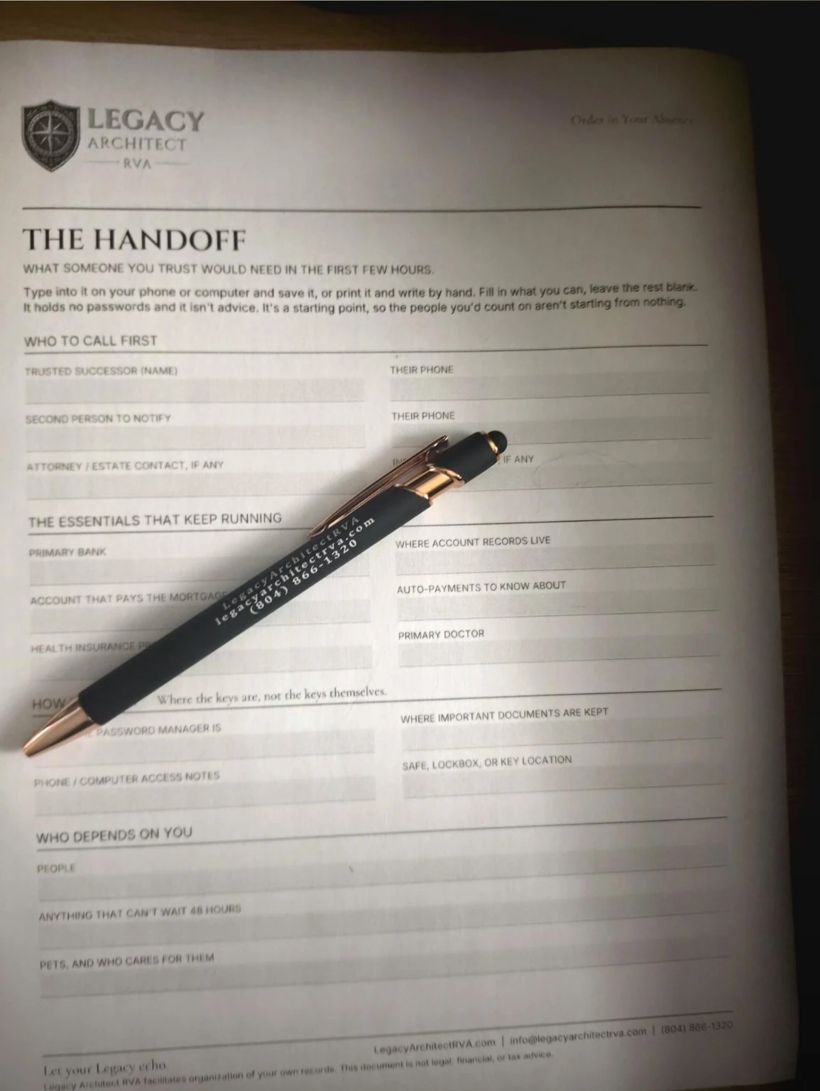 The Handoff worksheet printed on paper with a pen resting across it